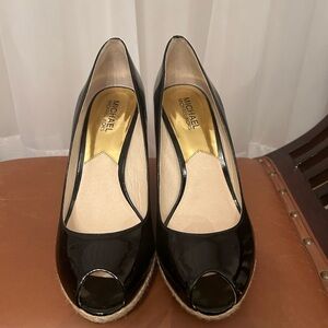Michael Kors peep toe shoes with wedge heal. Black patten leather.